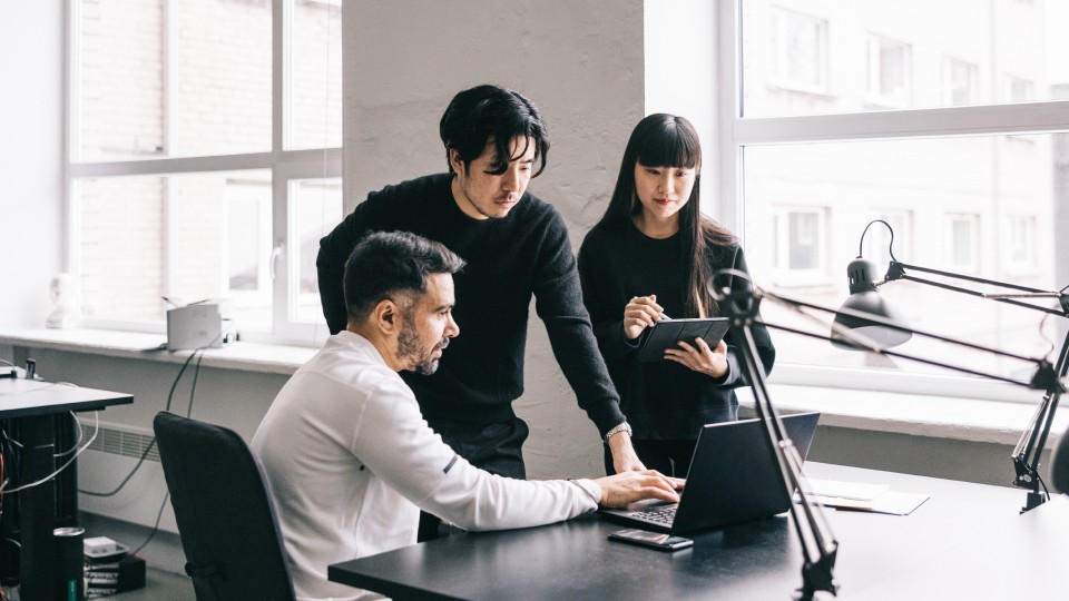 Team working around a desk