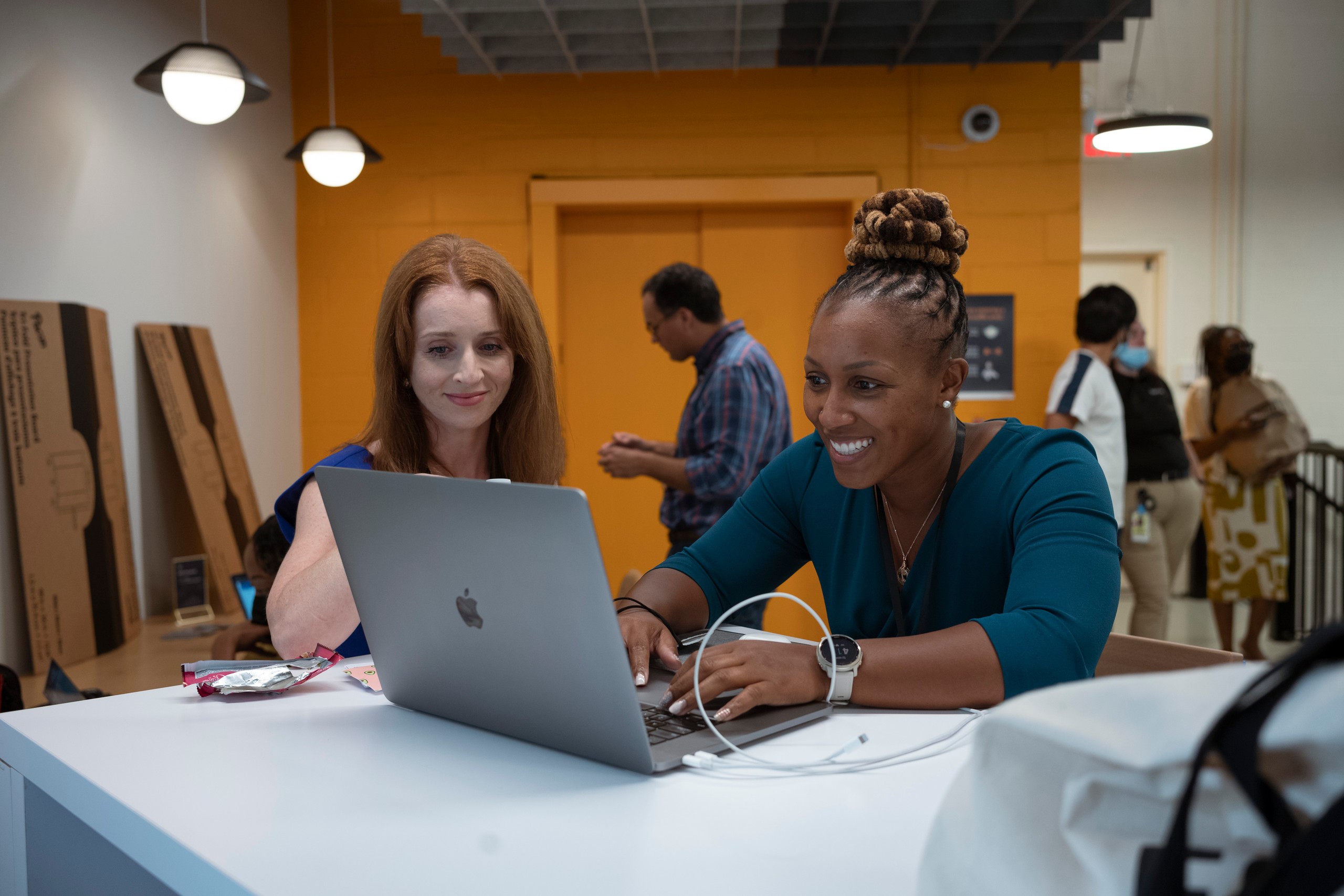 LaVonda meeting with a coach at the AWS Startup Loft in New York to finalize her pitch for Investor Day