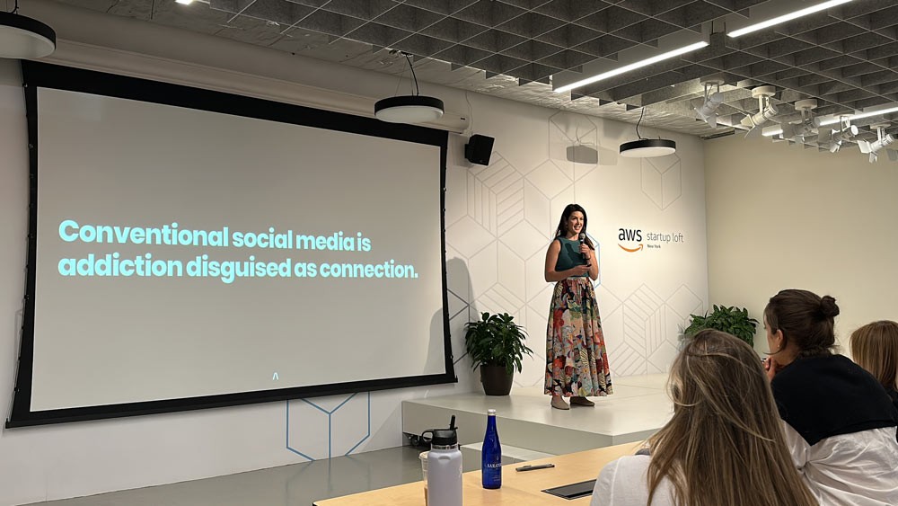 Ariana pitches during the AWS Impact Accelerator Investor Day to an audience of venture capitalists, supporters, and peers