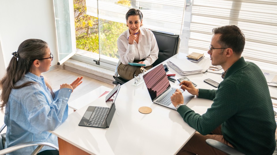 Colleagues around a desk