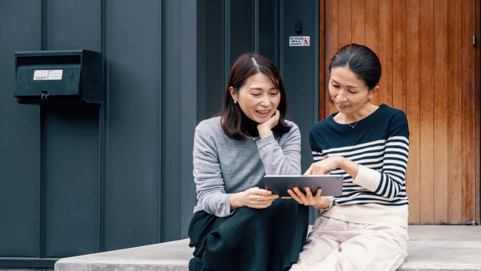 Women looking at a screen together