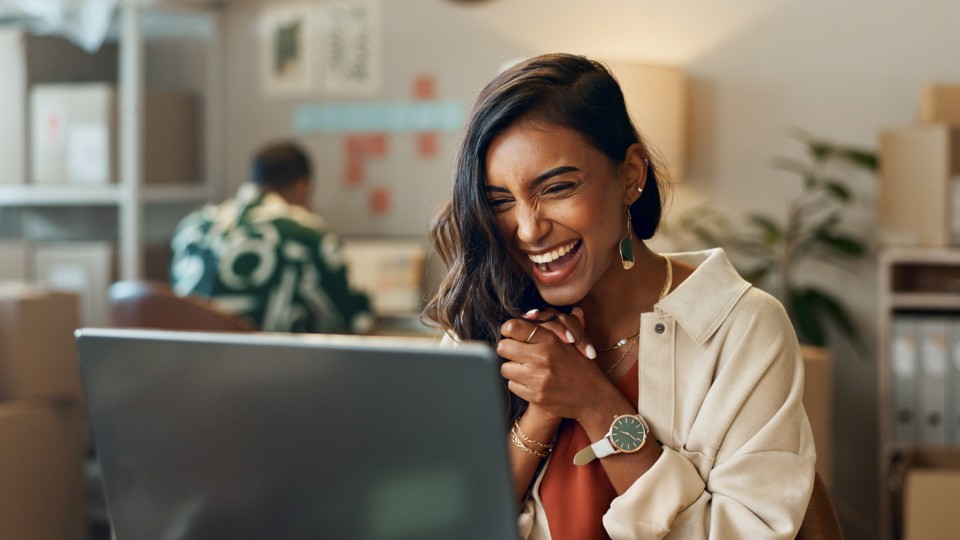Woman smiling at screen
