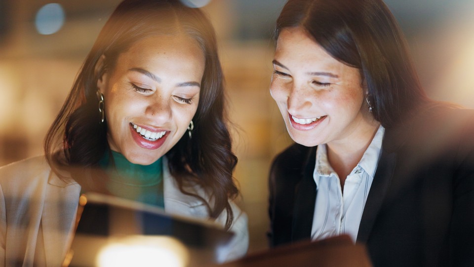 Women interacting with screen