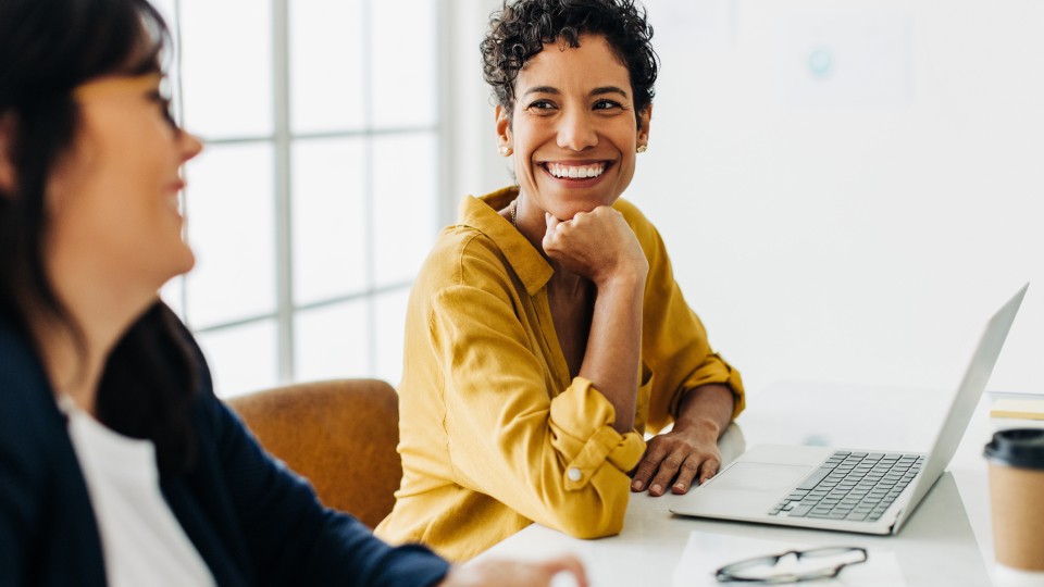 Women at work smiling