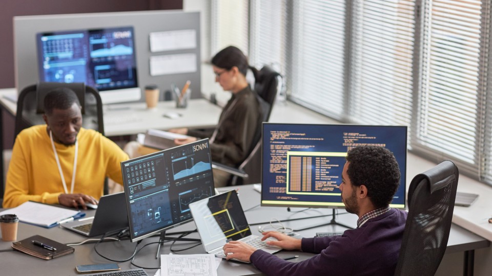 Employees at work in office environment